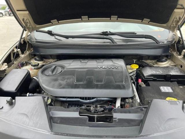 Photo of 2014 Tan Jeep Cherokee