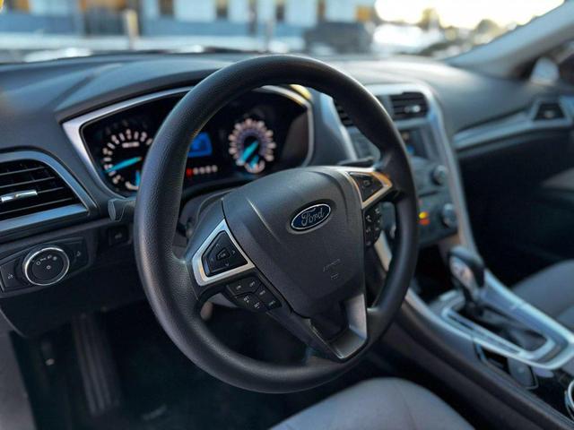 Photo of 2015 Ruby Red Tinted Clearcoat Ford Fusion