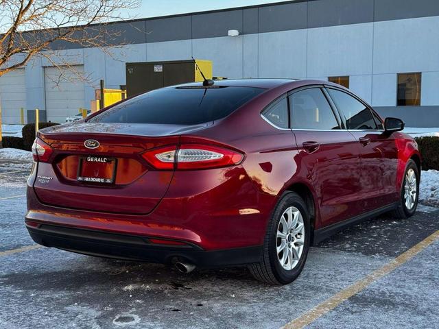 Photo of 2015 Ruby Red Tinted Clearcoat Ford Fusion