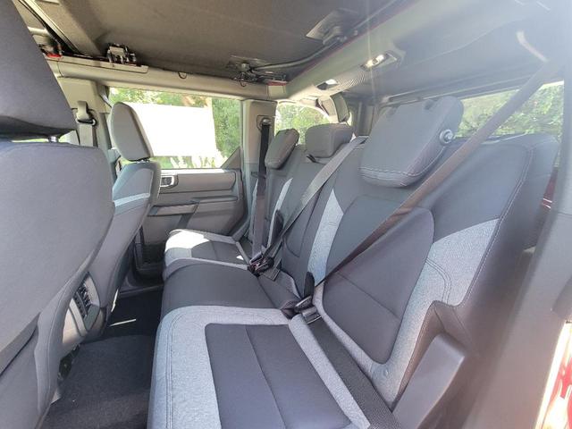 Photo of 2025 Ruby Red Metallic Tinted Clearcoat Ford Bronco