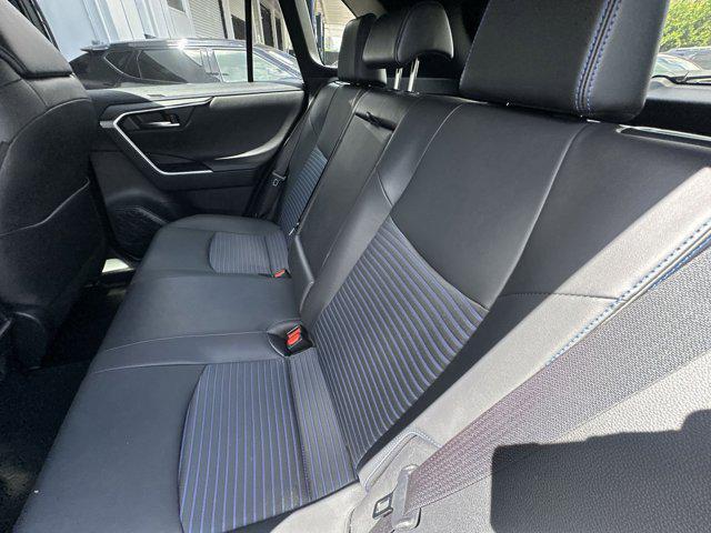 Photo of 2023 Wind Chill Pearl/Midnight Black Metallic Toyota RAV4 Hybrid