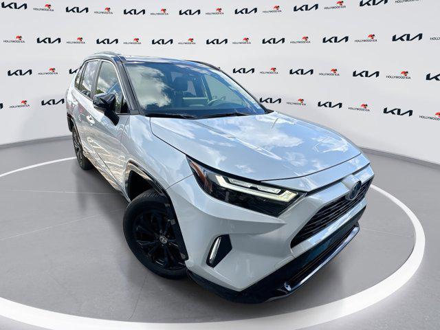 Photo of 2023 Wind Chill Pearl/Midnight Black Metallic Toyota RAV4 Hybrid