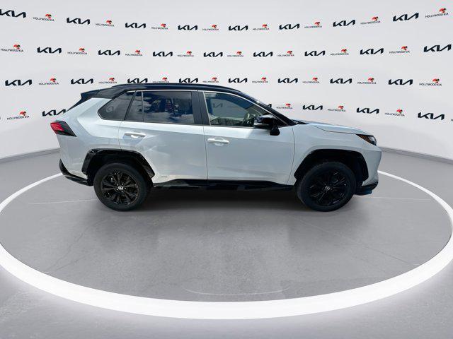 Photo of 2023 Wind Chill Pearl/Midnight Black Metallic Toyota RAV4 Hybrid
