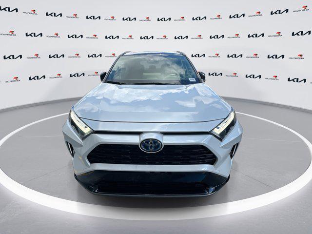 Photo of 2023 Wind Chill Pearl/Midnight Black Metallic Toyota RAV4 Hybrid