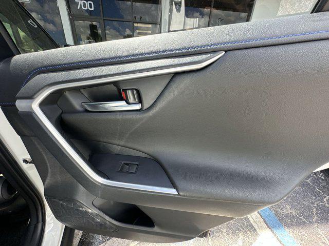 Photo of 2023 Wind Chill Pearl/Midnight Black Metallic Toyota RAV4 Hybrid