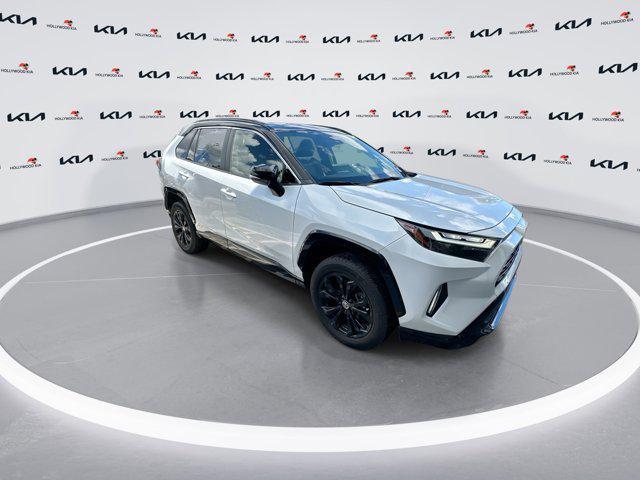 Photo of 2023 Wind Chill Pearl/Midnight Black Metallic Toyota RAV4 Hybrid