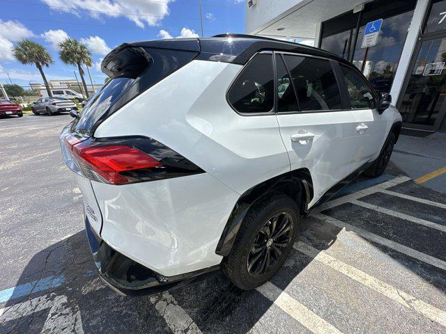 Photo of 2023 Wind Chill Pearl/Midnight Black Metallic Toyota RAV4 Hybrid