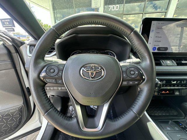 Photo of 2023 Wind Chill Pearl/Midnight Black Metallic Toyota RAV4 Hybrid