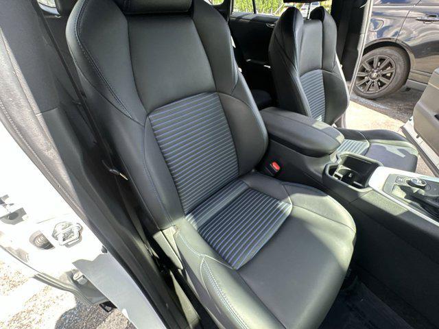 Photo of 2023 Wind Chill Pearl/Midnight Black Metallic Toyota RAV4 Hybrid