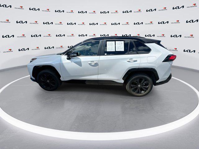 Photo of 2023 Wind Chill Pearl/Midnight Black Metallic Toyota RAV4 Hybrid