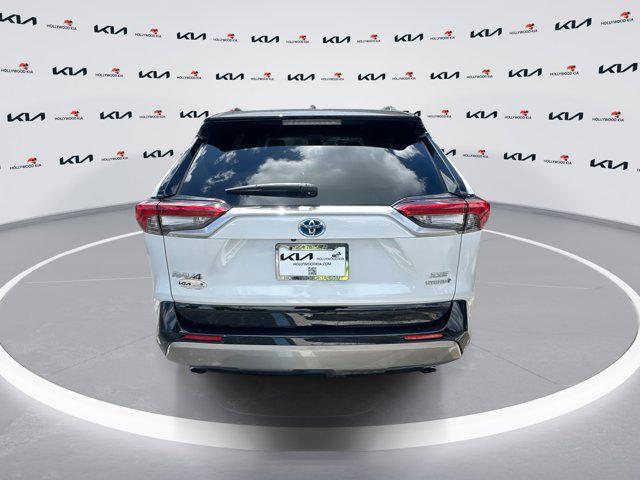 Photo of 2023 Wind Chill Pearl/Midnight Black Metallic Toyota RAV4 Hybrid