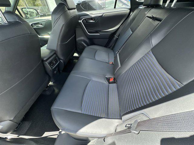 Photo of 2023 Wind Chill Pearl/Midnight Black Metallic Toyota RAV4 Hybrid