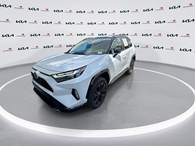 Photo of 2023 Wind Chill Pearl/Midnight Black Metallic Toyota RAV4 Hybrid