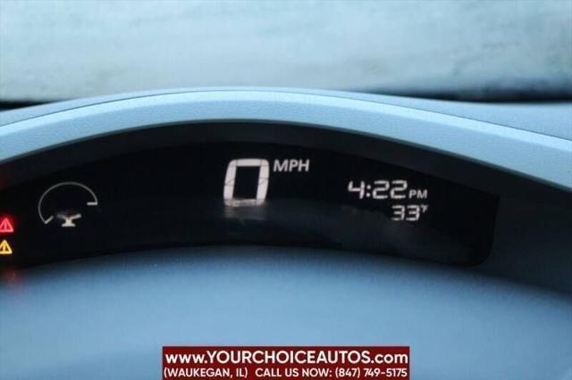 Photo of 2011 Cayenne Red Nissan Leaf