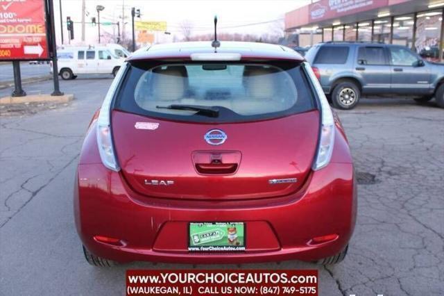 Photo of 2011 Cayenne Red Nissan Leaf