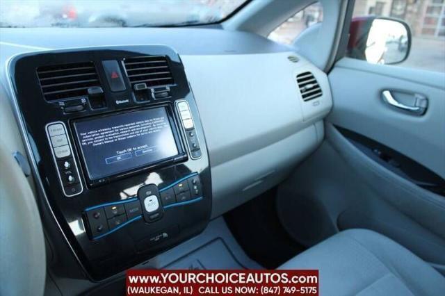 Photo of 2011 Cayenne Red Nissan Leaf
