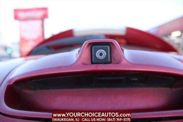 Photo of 2011 Cayenne Red Nissan Leaf