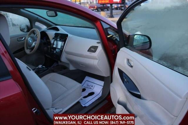 Photo of 2011 Cayenne Red Nissan Leaf