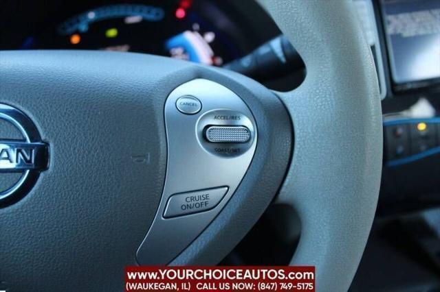 Photo of 2011 Cayenne Red Nissan Leaf