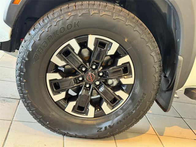 Photo of 2023 Glacier White Nissan Frontier