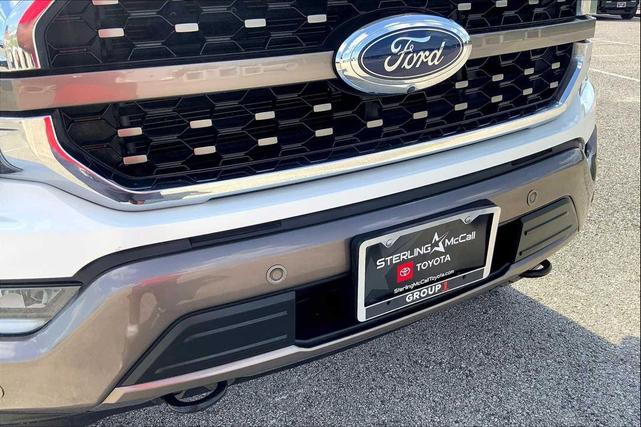 Photo of 2023 Star White Metallic Tri-Coat/Stone Gray Ford F-150