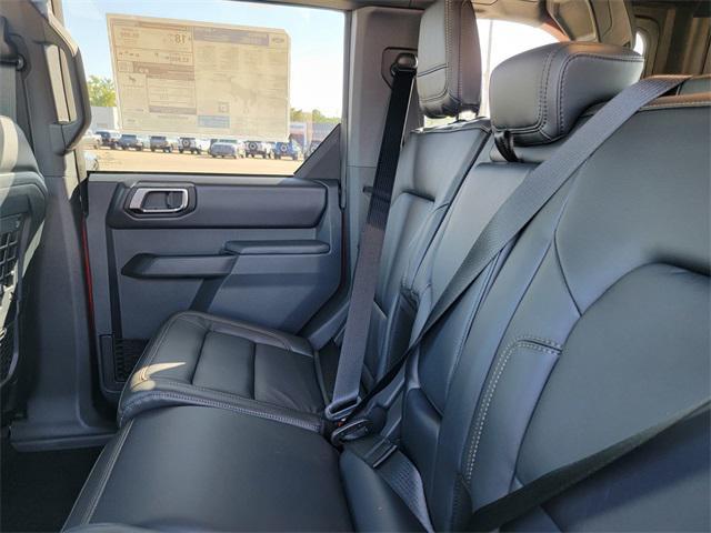 Photo of 2025 Ruby Red Metallic Tinted Clearcoat Ford Bronco