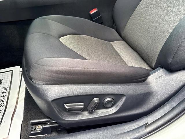Photo of 2022 White Toyota Camry Hybrid