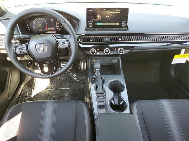 Photo of 2025 Boost Blue Pearl Honda Civic