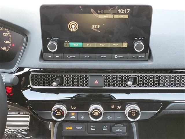 Photo of 2025 Boost Blue Pearl Honda Civic