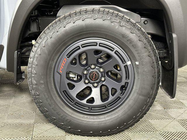 Photo of 2025 Boulder Gray Pearl Nissan Frontier