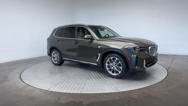 Photo of 2026 Manhattan Green Metallic BMW X5 PHEV