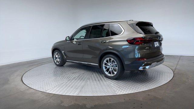 Photo of 2026 Manhattan Green Metallic BMW X5 PHEV