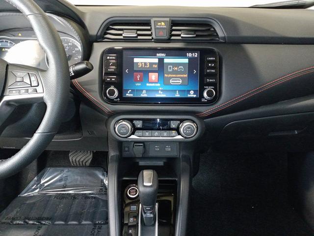 Photo of 2025 Aspen White Tricoat Nissan Versa