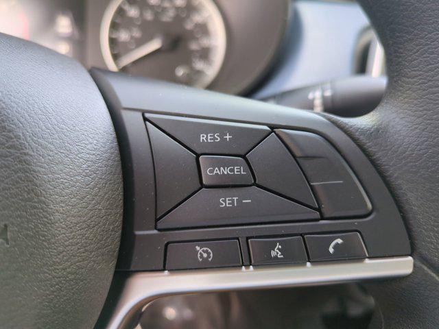 Photo of 2025 Scarlet Ember Tintcoat Nissan Versa
