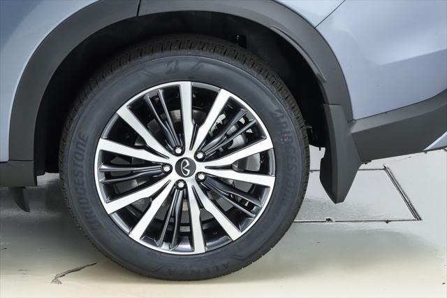 Photo of 2025 Moonbow Blue/Black Obsidian INFINITI QX60