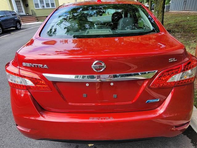 Photo of 2013 Red Brick Nissan Sentra