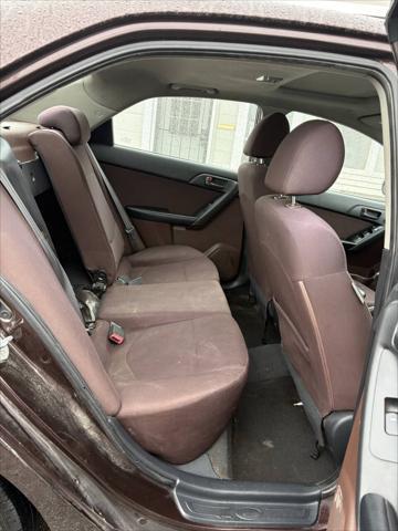 Photo of 2010 Burgundy Kia Forte