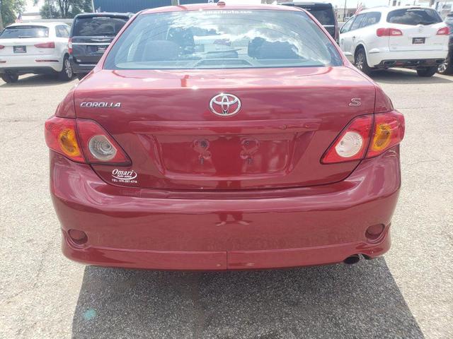 Photo of 2009 Barcelona Red Metallic Toyota Corolla