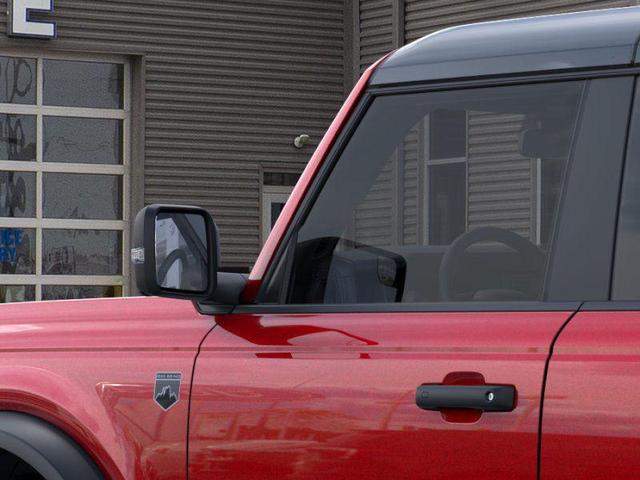 Photo of 2025 Ruby Red Metallic Tinted Clearcoat Ford Bronco