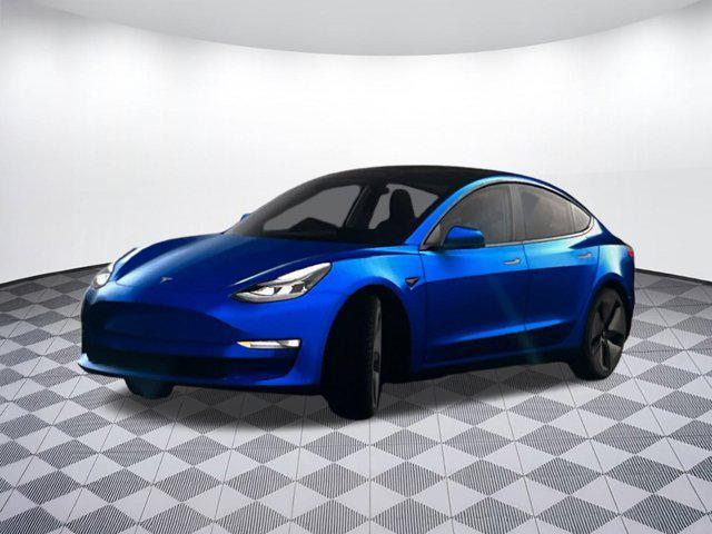Photo of 2023 Deep Blue Metallic Tesla Model 3