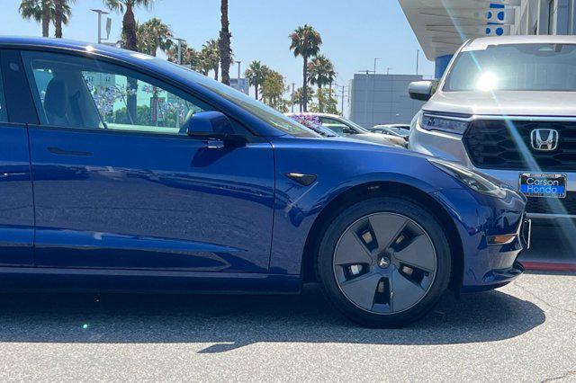 Photo of 2023 Deep Blue Metallic Tesla Model 3