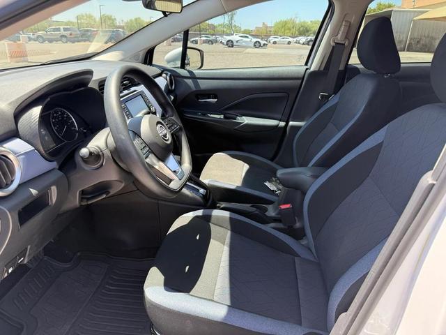 Photo of 2024 Aspen White Tricoat Nissan Versa