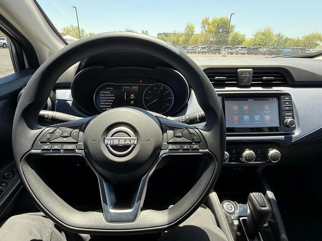 Photo of 2024 Aspen White Tricoat Nissan Versa