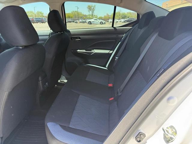 Photo of 2024 Aspen White Tricoat Nissan Versa