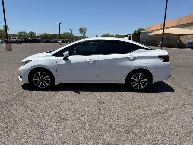 Photo of 2024 Aspen White Tricoat Nissan Versa