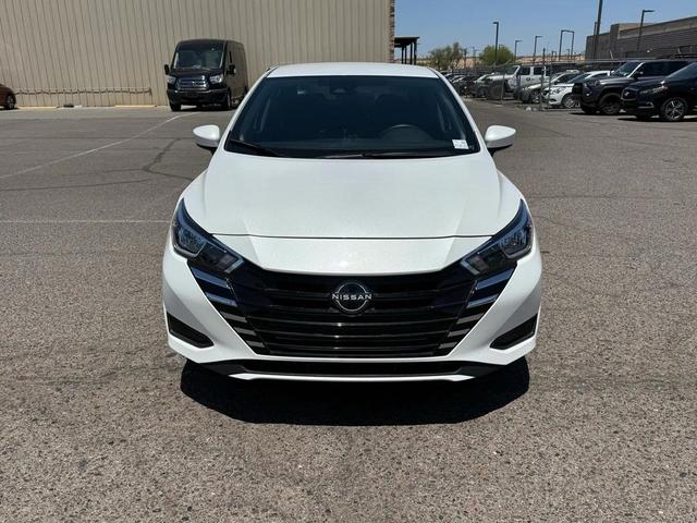 Photo of 2024 Aspen White Tricoat Nissan Versa