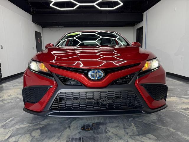 Photo of 2023 Supersonic Red Toyota Camry Hybrid