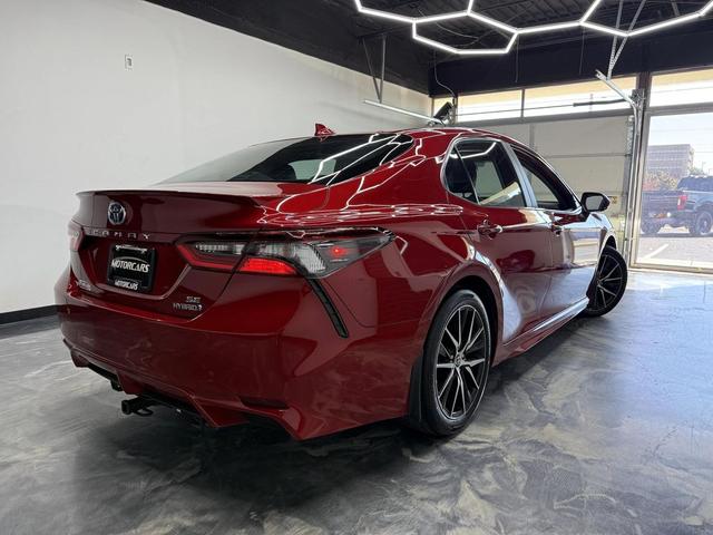 Photo of 2023 Supersonic Red Toyota Camry Hybrid