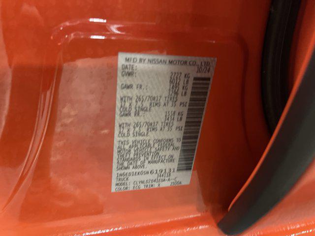 Photo of 2025 Afterburn Orange Nissan Frontier