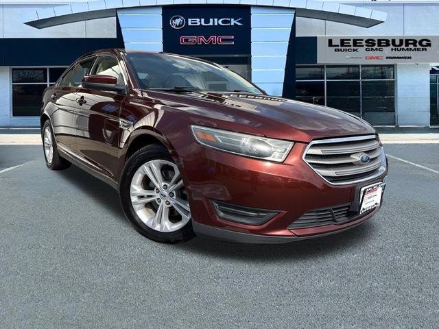 Photo of 2015 Ruby Red Metallic Tinted Clearcoat Ford Taurus